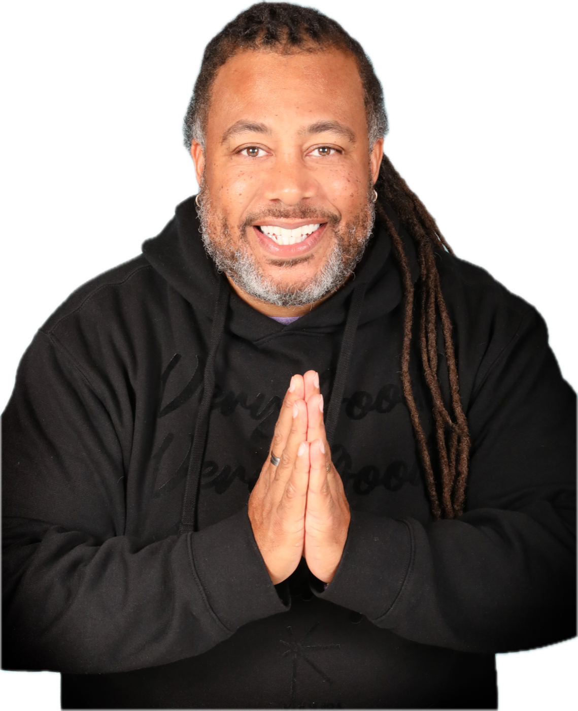 Dr. Harvey Hinton III, hands together, smiling.